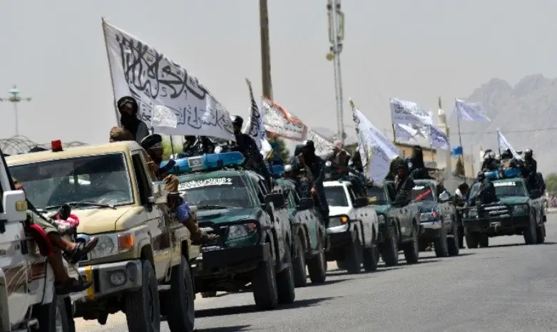 Taliban fighters atop vehicles Taliban fighters atop vehicles with Taliban flags parade along a road to celebrate after the US pulled all its troops out of Afghanistan, in Kandahar on September 1, 2021 following the Taliban’s military takeover of the country.