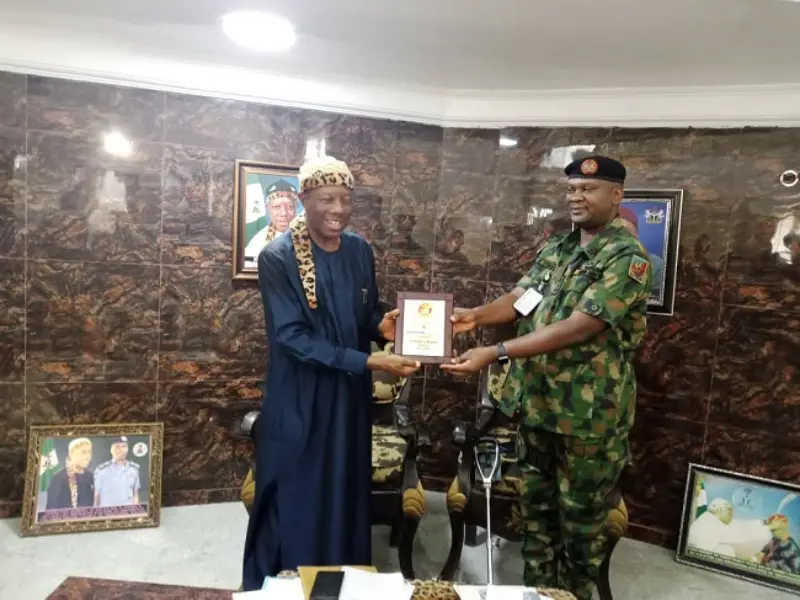 presentation of an award of merit to Eze Nwokocha by Utsaha in recognition of his contributions to civil-military cooperation in the state.